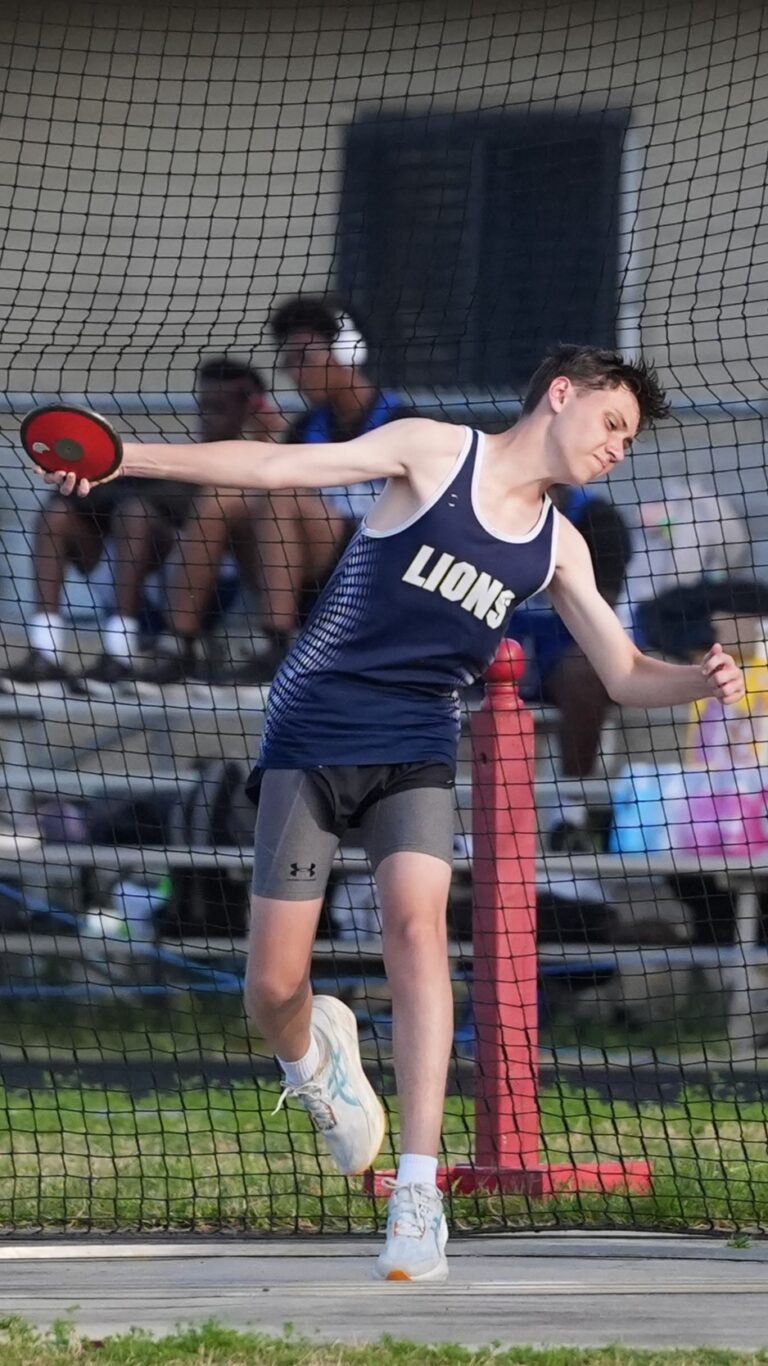 Discus thrower at full extension in the ring