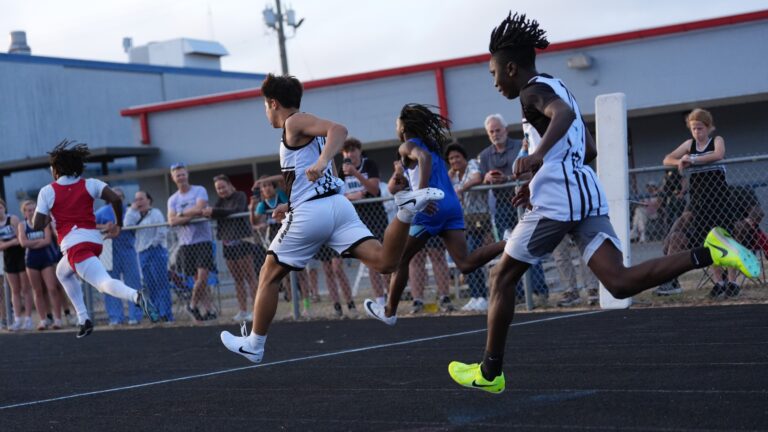 Sprinters explode out of the blocks at a Panhandle track meet