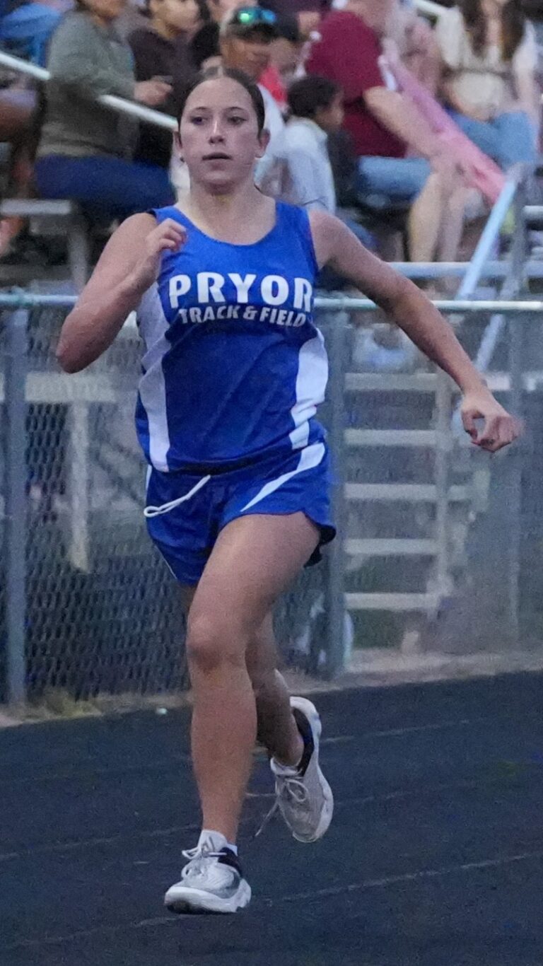 Pryor Track and Field sprinter driving down the straight