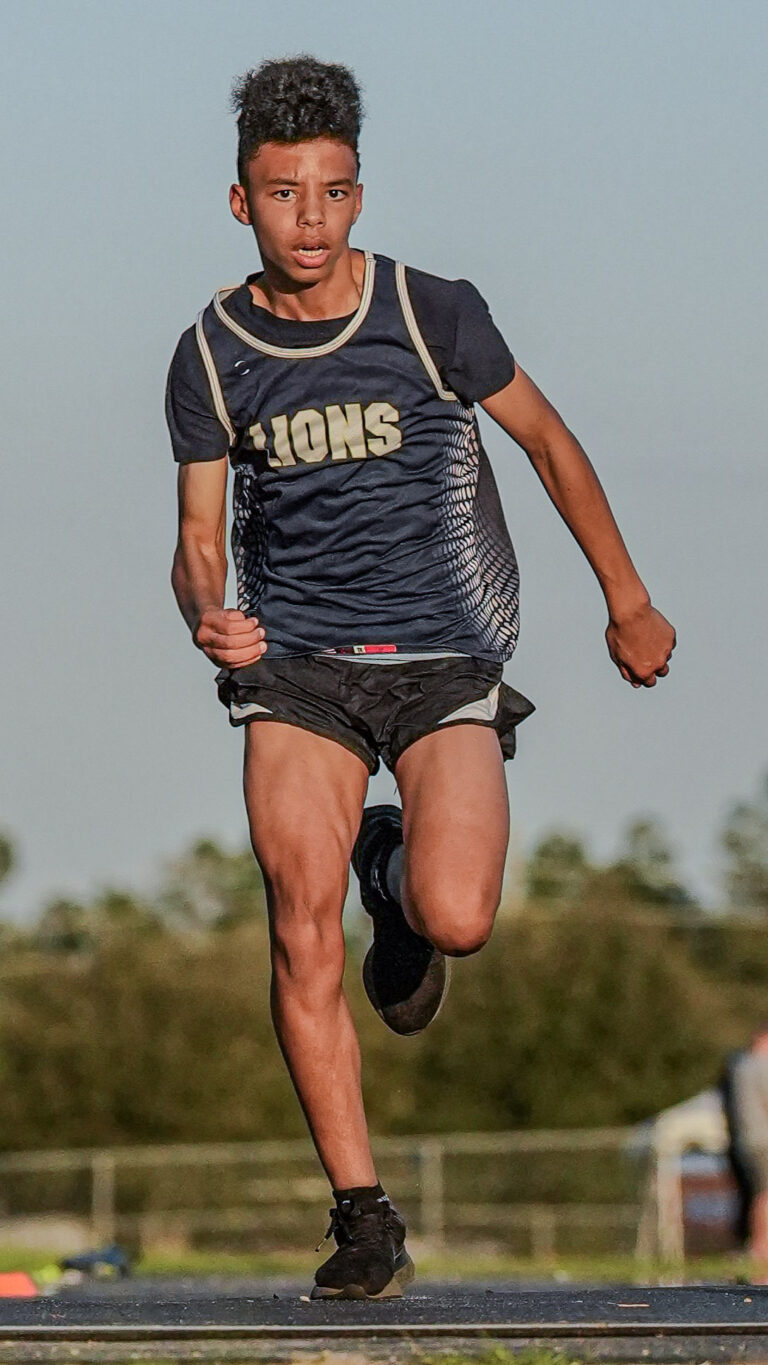 Lions distance runner mid-stride