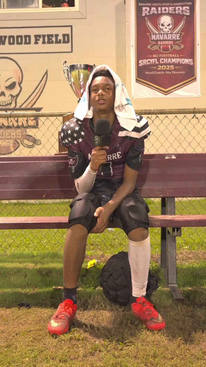 Athlete on the bench under the lights answering questions into a Showcase You microphone